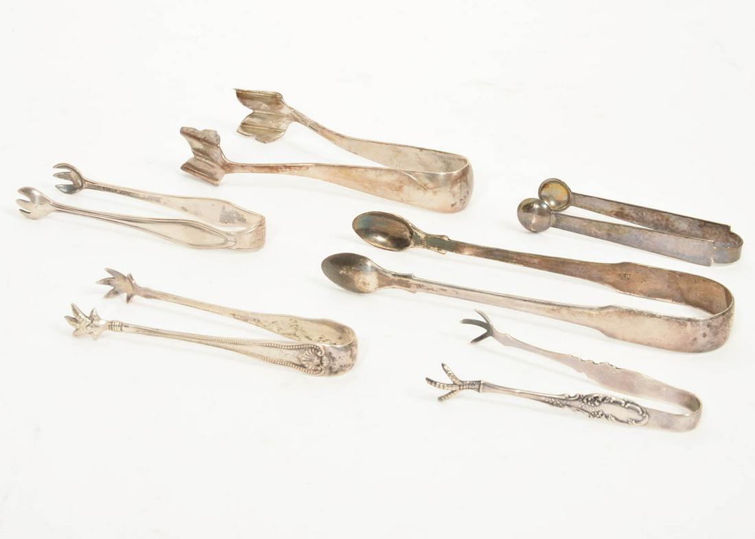 Lot of 6 Silver Ice Tongs: Includes: 5 sterling ice tongs (107.1 grams)), range in size from 3.5" to 5" long. One silver-plate tongs 6". Likely mix of English and American makers. Hallmarked on inside. Condition report: Good co
