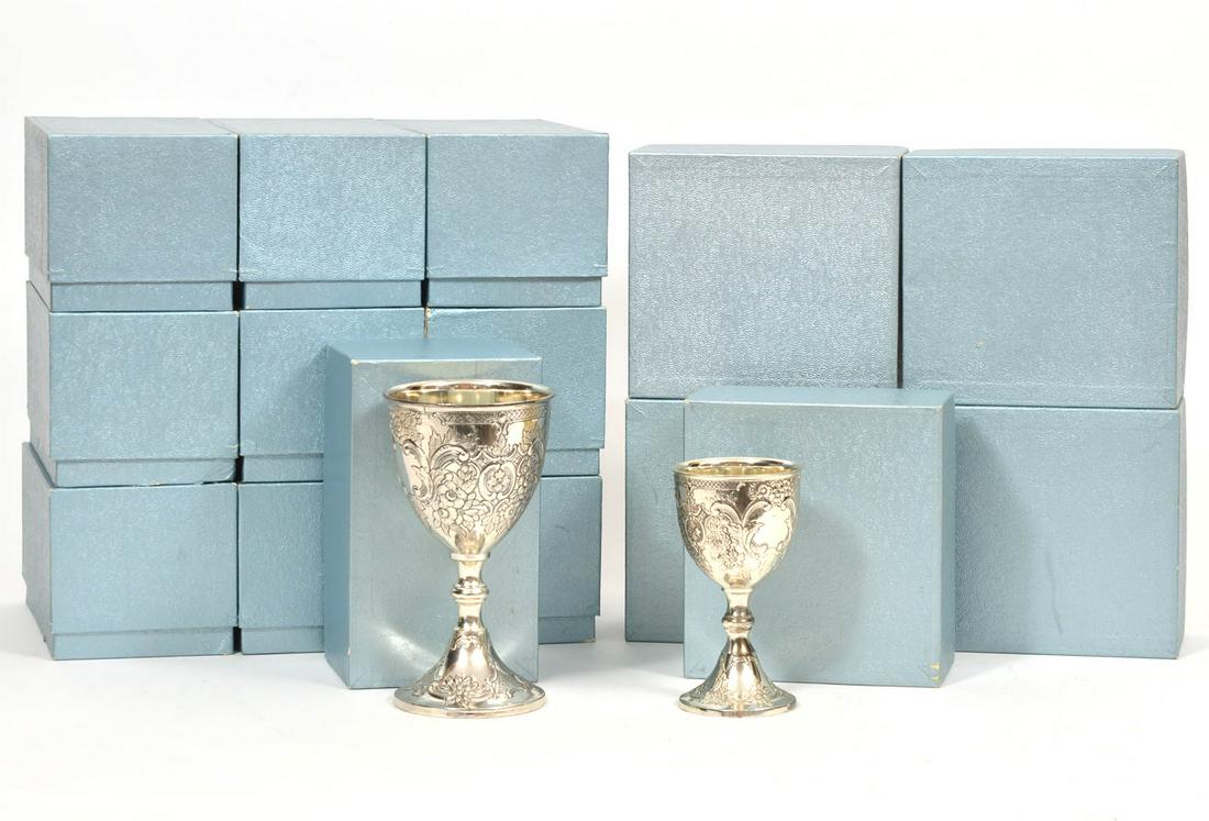 Lot of 18 Corbell & Co Silver-Plated Goblets: Includes: 9 Water Goblets 5.25", 9 Wine Goblets 6.75". Electro-plated silver with foliate motif. Comes in original boxes. Condition report: Good condition, minor wear to a few goblets, please examine 