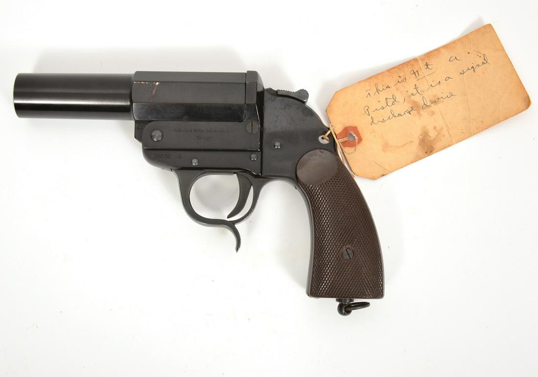 WW2 Walther Model 26 Flare Gun: Karl Walther Germany model 26 flare pistol, World War II era, has German proof marks and serial numbers on side. Checkered plastic grips and original lanyard ring. 9.5" x 6". Hand-written tag attached