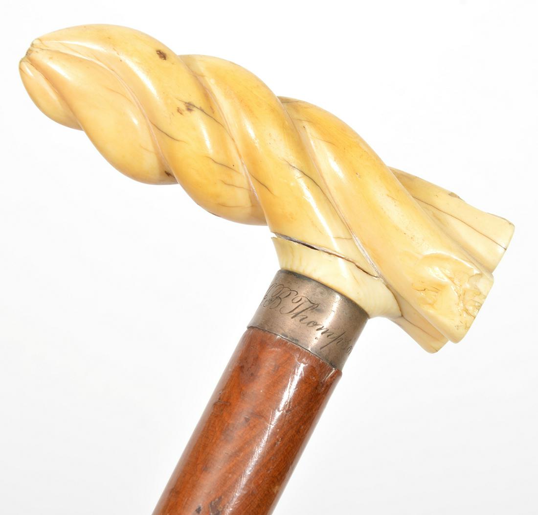 Hand-Carved Bone Handle Walking Stick Cane: Carved bone set in personalized sterling silver band handle, medium-color wood walking stick/cane. 34" Tall. Condition report: Good condition, common wear for age and use, please examine all photos cl