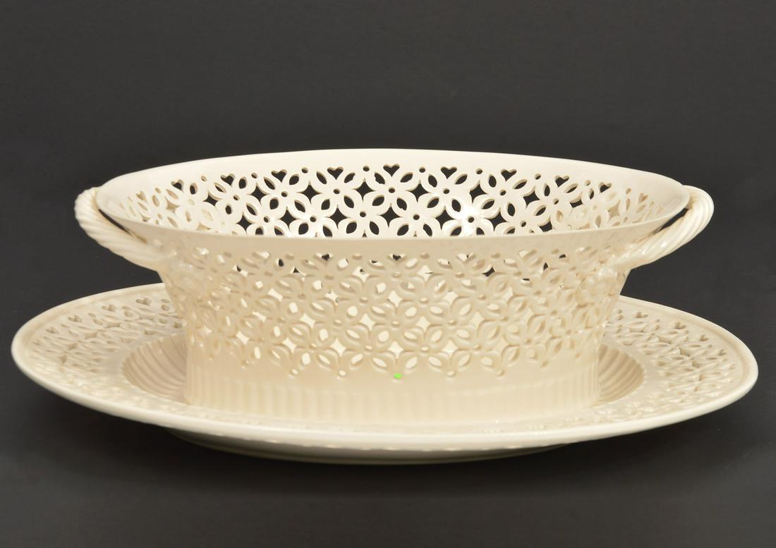 English Creamware Pierced Bowl & Underplate: Vintage English Creamware Leedsware porcelain pierced openwork oval bowl wiith underplate, marked on bottom. Bowl has 2 braided handles and measures 8 5/8"L x 6.5"W x 2 7/8"H; underplate 10"L x 8 7/8"
