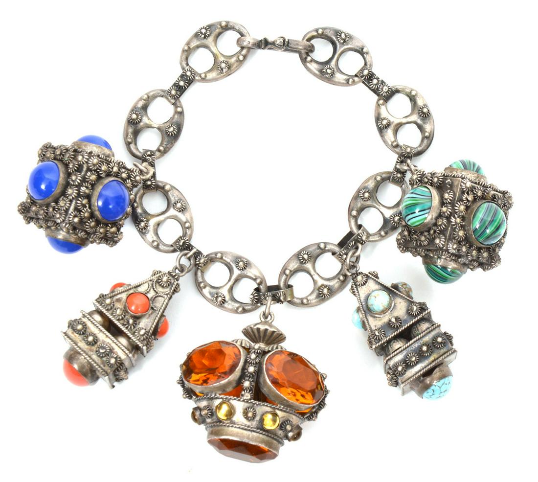 Italian Etruscan Revival 800 Silver Bracelet: Vintage Italian Etruscan Revival 800 silver bracelet with five ornamental jeweled fobs/charms, with hook clasp. Various inset stones on each cannetille decorated charm, 8.5" long. 106.2gr. Condition r