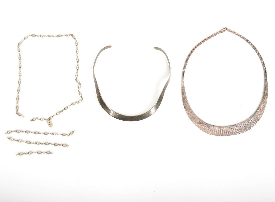 3 Sterling Silver Necklaces in Assorted Styles: 3 sterling silver necklaces include 1 textured cuff necklace, 1 wavy collar choker and 1 beaded chain necklace. Total weight 54 grams. Condition report: good condition, beaded chain necklace needs to 
