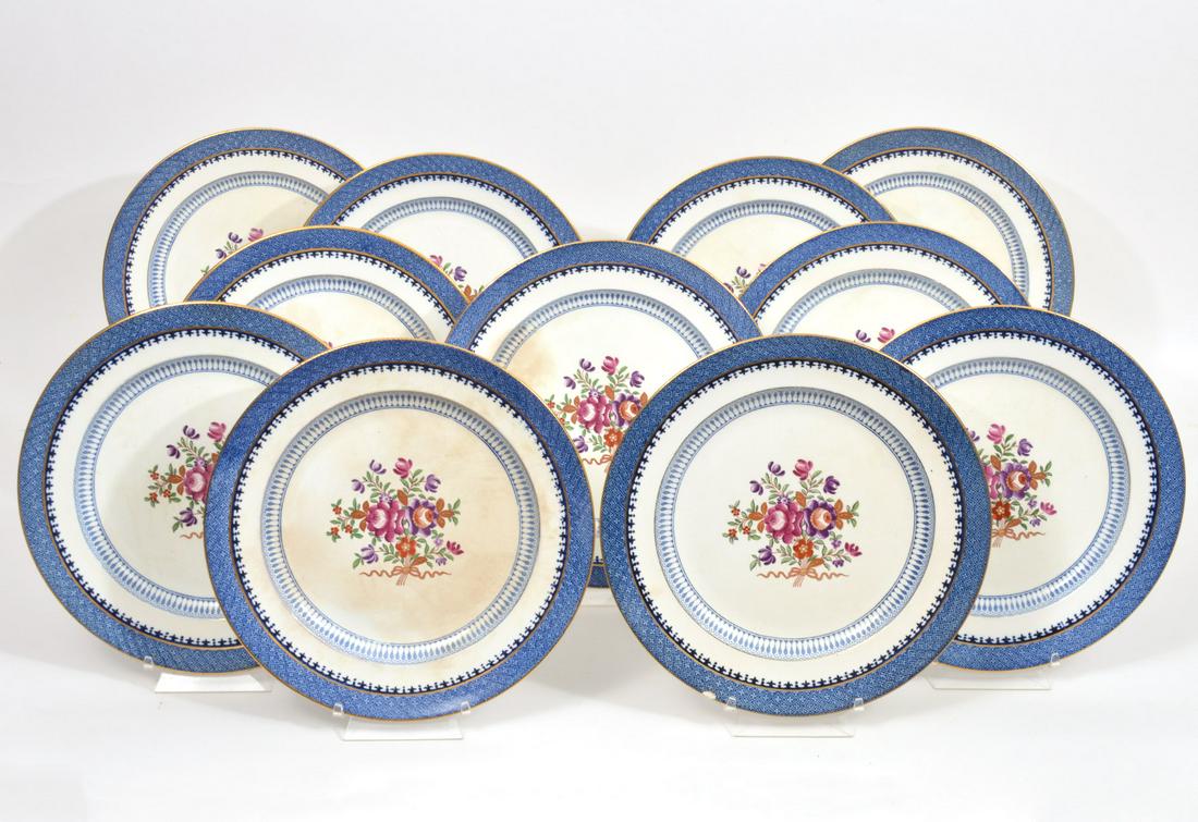 11 Booth's England Plates For Tiffany & Co.: English Booth's 'Lowensoft Border' Silicon china dinner plates made for Tiffany & Co. Floral decoration in center, blue border. Measures 10.5"W. Hallmarked on underside. Condition report: Good conditi