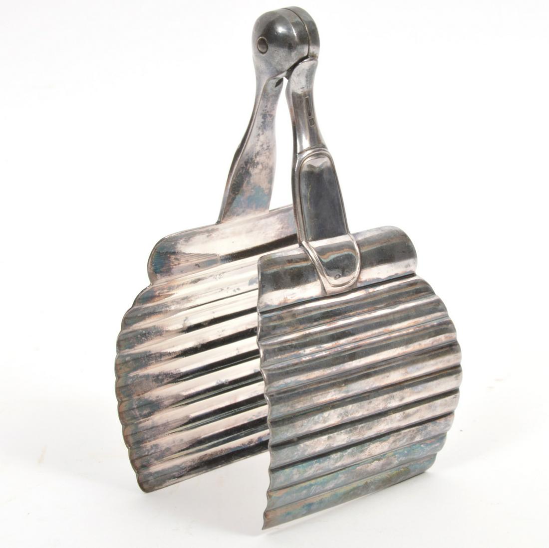 Christofle 'Cannele' Pattern Asparagas Tongs: Christofle France Art Deco-Style 'Cannele' pattern silverplate asparagas tongs. Signed and hallmarked with justice balance. Measures 3.25"L x 2.75"W x 6"H. Weight - 187g. Condition report: Good condit