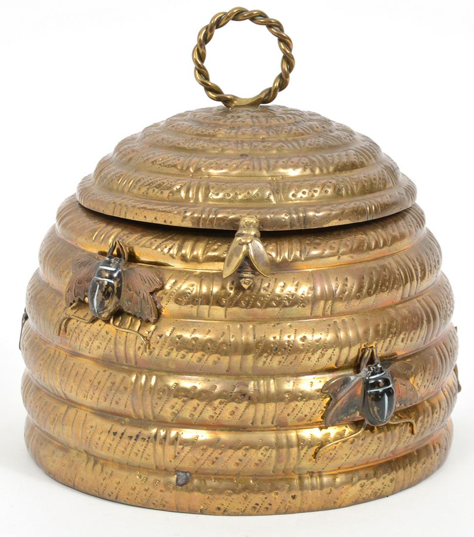 Mottahedeh Brass Beehive Hinged Box: Mottahedeh brass beehive hinged box with applied bee decorations, rope-style ring finial on top. Impressed mark on underside. Measures 6.75"W x 7"H. Condition report: Good condition, common wear to br