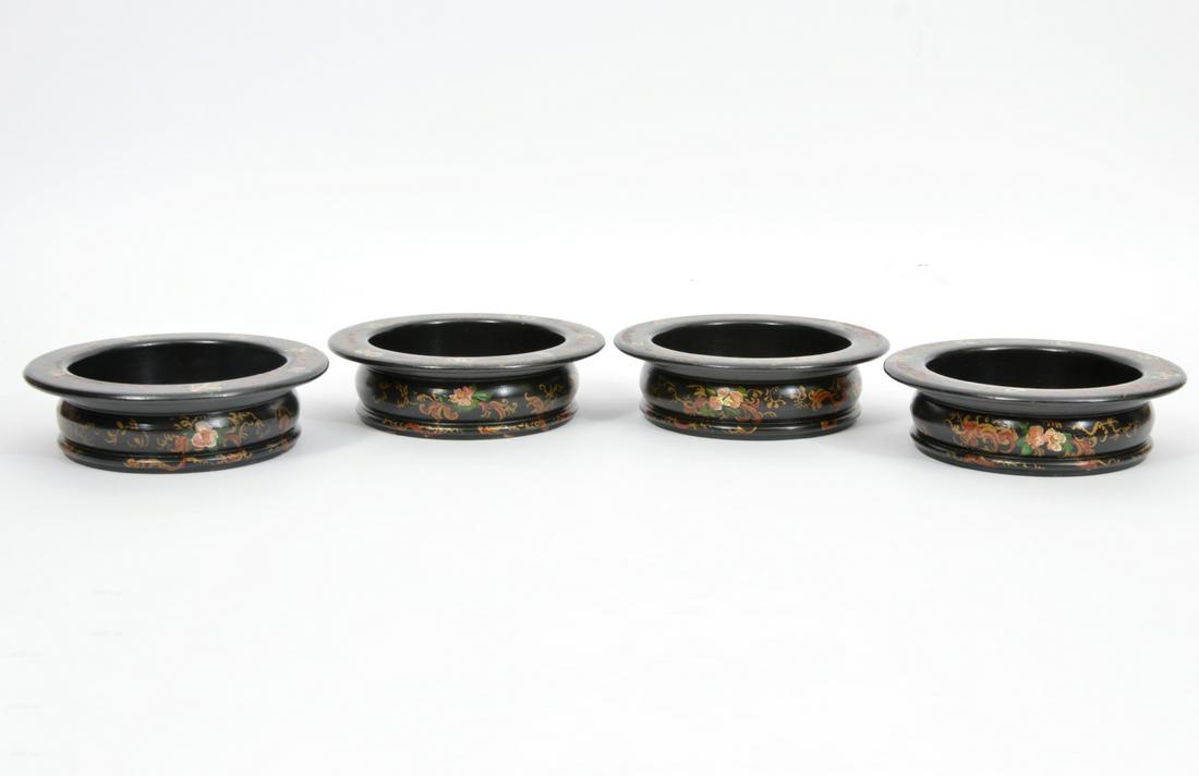 4 Hand-Painted Floral Black Lacquer Wine Coasters: Set of four hand-painted floral motif black lacquer wine coasters, 6.75" diameter x 2"H. Condition report: Scratches and paint loss throughout, please examine all photos closely. Contact C. Biddle Auc