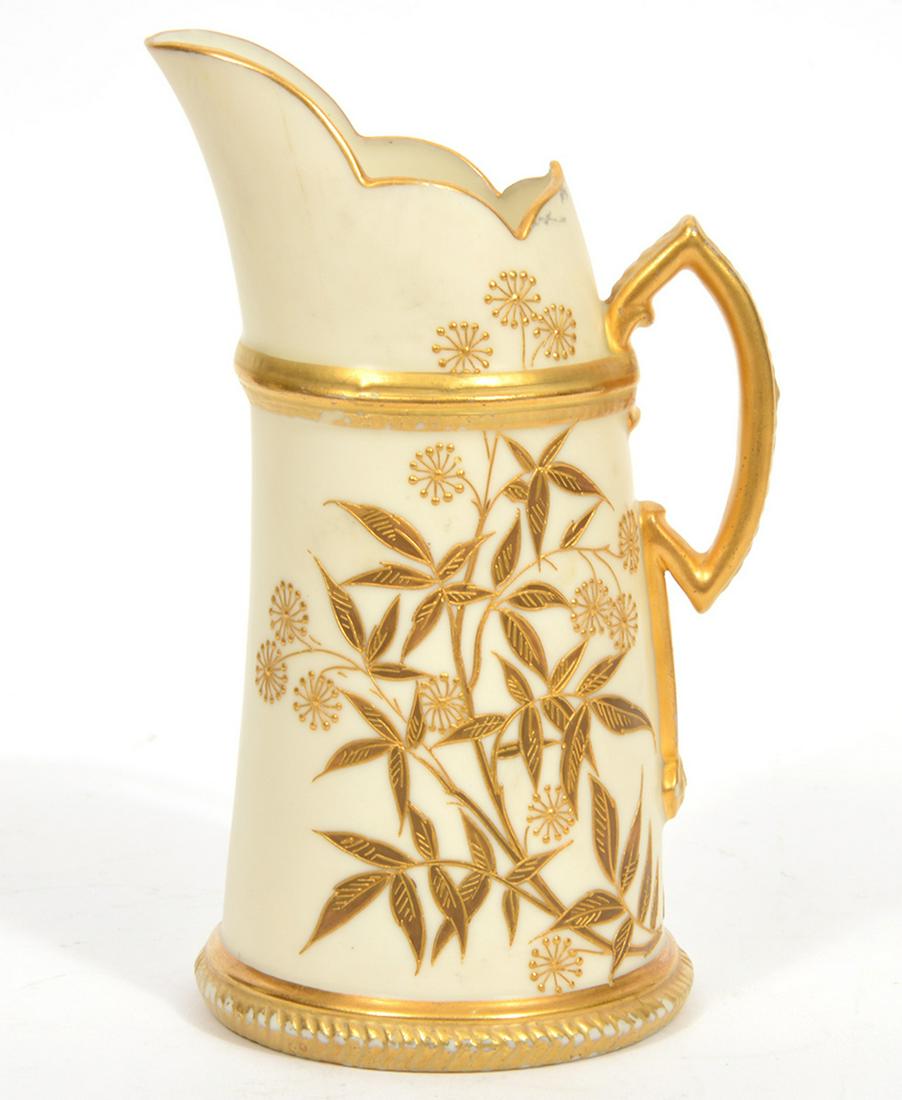 Royal Worcester Porcelain Creamer: Royal Worcester gold-painted creamer decorated with raised bamboo leaves. Measures 7"L x 4"W. Hallmarked on underside. Condition report: Good condition, some paint loss, please examine all photos clos