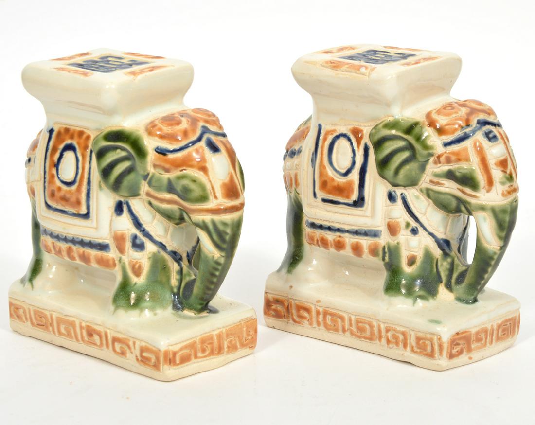 Pr. Vintage Ceramic Hand Painted Elephant Bookends: Pair of vintage ceramic elephant bookends with glossy finish and Greek key designs around base. Measures 4.75"H x 4"L x 2"W. Condition report: chip to bottom of one, please see photos. Contact C. Bidd
