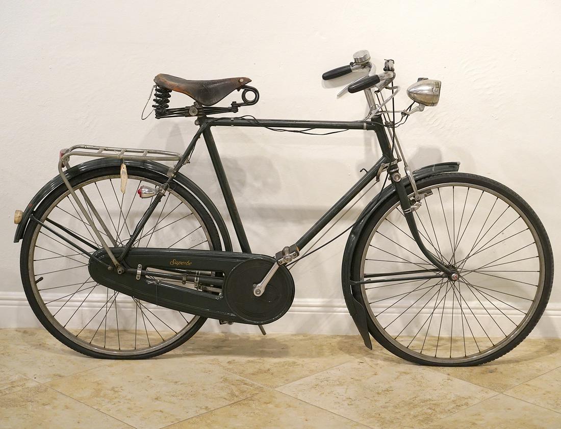 Vintage Raleigh 'Superbe' Sports Bike: Vintage Raleigh sports bike. Model: Superbe. Brooks leather seat. Selling it as in found condition (tires flat, light spray painted black, etc). From front wheel to back wheel: 67". Contact C. Biddle 