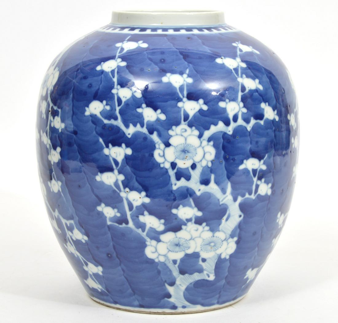 Chinese Blue and White Glazed Porcelain Vase: Chinese blue and white glazed porcelain vase, decorated with cherry blossom motif, double ring marked on underside. Measures 9"W x 10.75"H. Condition report: Slightly rough underside edge, please exam