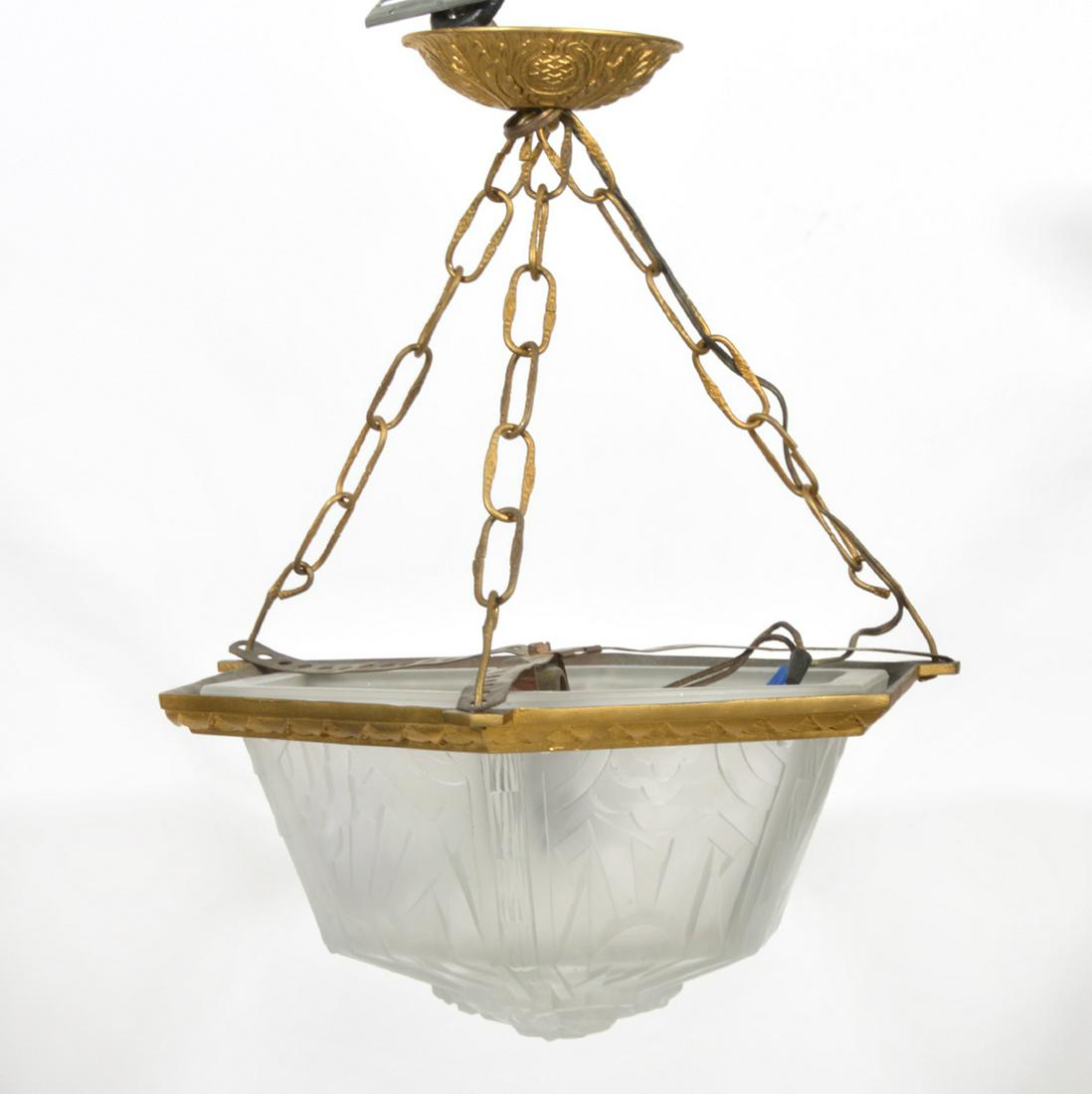 French Art Deco Frosted Glass Chandelier: French Art Deco hexagon shaped frosted glass and gilt bronze chandelier with single socket. Molded and frosted glass is decorated with impressed art deco designs and mounted in gilt bronze. Measures 1