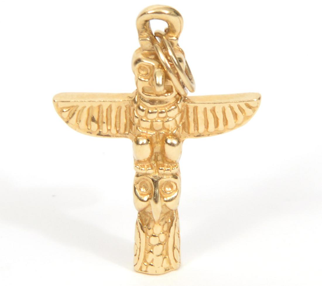 14kt Yellow Gold Totem Pole Charm Pendant: 14kt gold Totem Pole pendant charm. Marked on bottom. 3 DWT. 1" L. Condition report: good, no issues. Please examine all photos closely. Contact C. Biddle Auction Gallery for more detailed information