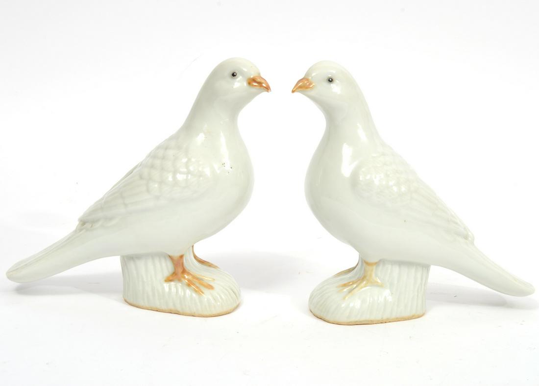 Pair of Chinese Glazed Porcelain White Doves: Pair of Chinese glazed porcelain white doves figures, measures 6"L x 2.75"W x 6.25"H. Condition report: One dove has chip to end of beak, minor flaws in firing process, please examine all photos close