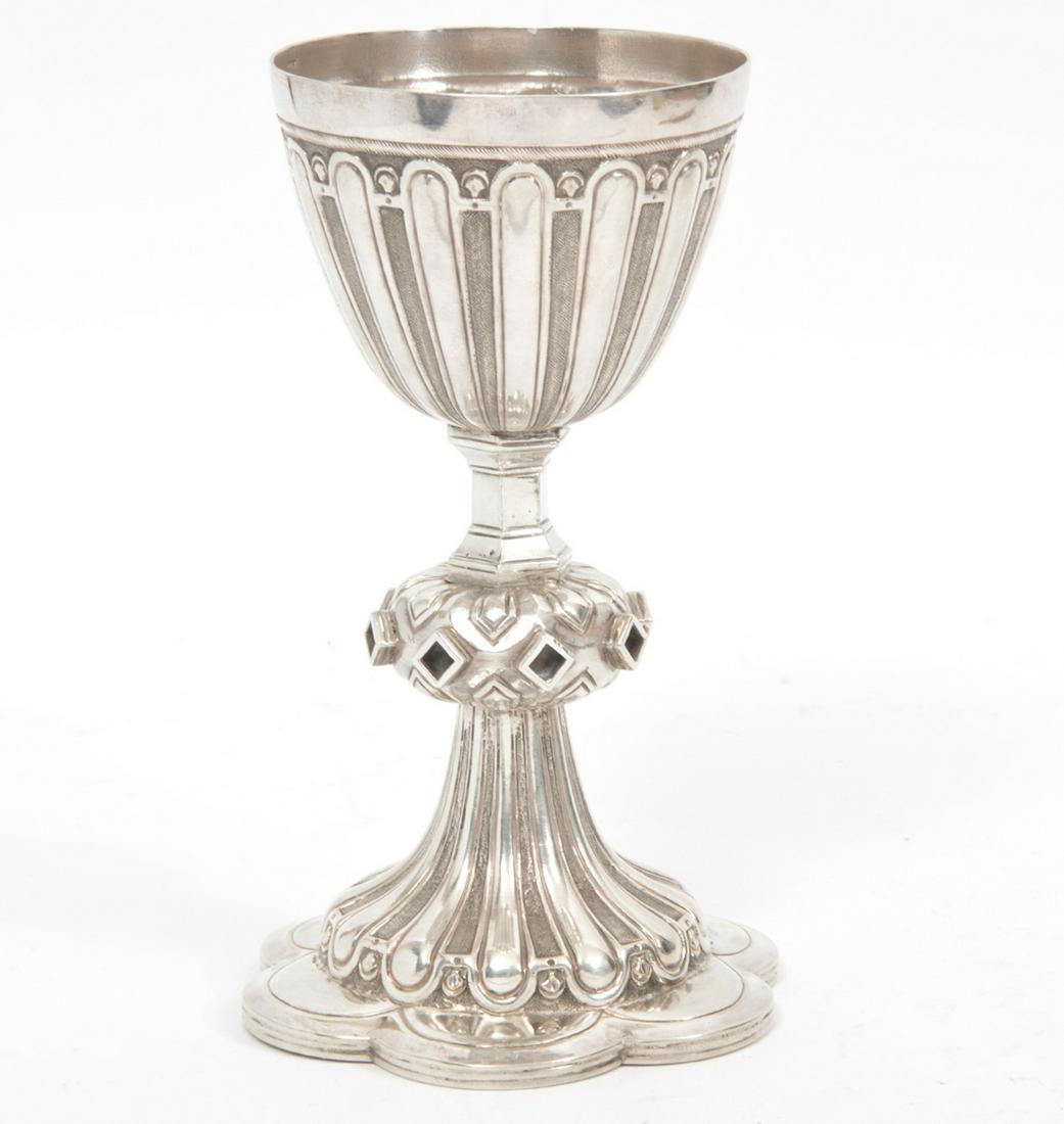 Gothic Revival Style Sterling Silver Wine Chalice: Gothic Revival Style sterling silver wine chalice, six lobed base, measures 8"H x 4.75"W. Sterling mark on inside. Weight - 515.2 g. Condition report: Missing diamond shaped jewels on stem, common wea