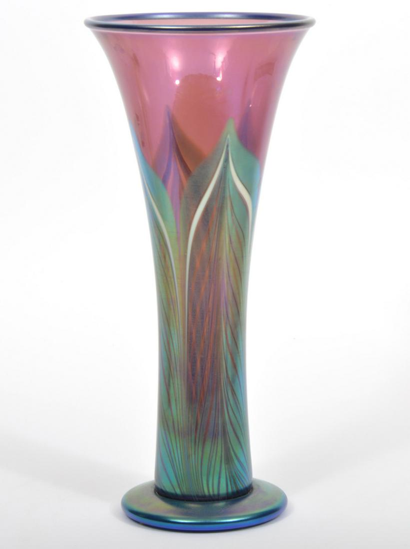 Orient & Flume Iridescent Art Glass Vase: Orient & Flume iridescent art glass trumpet vase with green feathers on purple ground, etched on base 'Beyers Sellers Orient & Flume'. Measures 12.25"H x 5.5"W top x 4 1/8"W base. Condition report: go