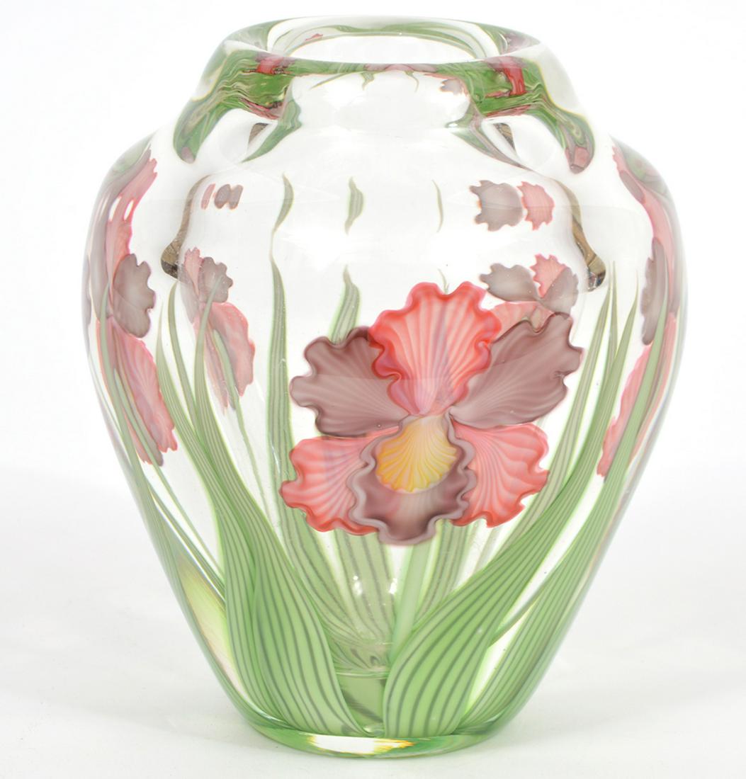 Orient & Flume Studio Art Glass Amaryllis Vase: Orient & Flume studio art glass amarylis vase signed and numbered on underside, Held 29/300. Measures 5.5"H x 4.25"W. Original booklet included. Condition report: good condition, see photos. Contact C