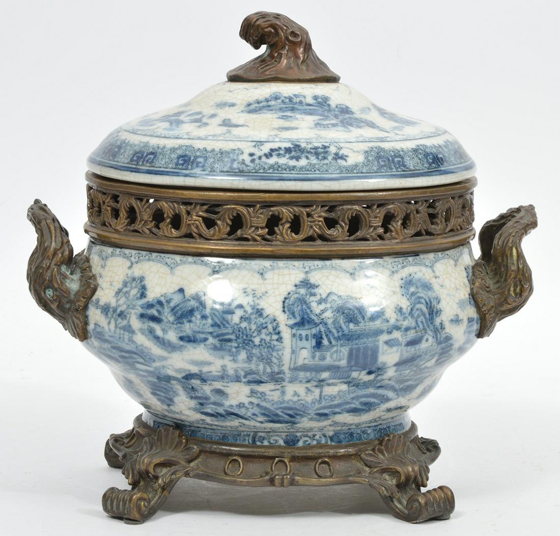 English Chinoiserie Porcelain Metal Mounts Tureen: Decorative English Chinoiserie crackle glaze porcelain metal mounted footed tureen, with branch style handles and finial. Foliate open work mount. Unknown underglaze mark. Measures 10.5"L x 8"W x 10.7