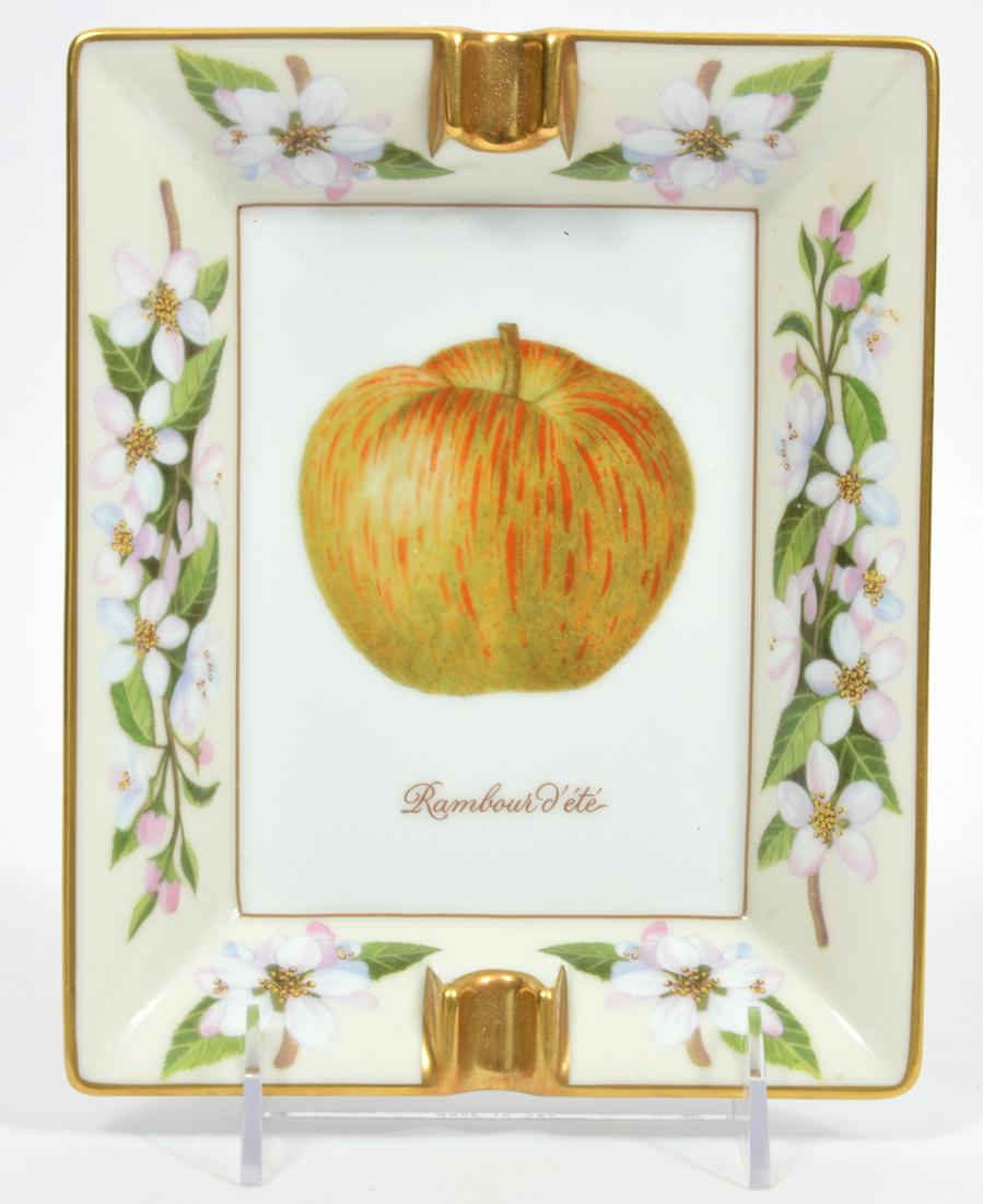 Hermes 'Rambour d'ete Pommes' Porcelain Ashtray: Hermes 'Rambour d'ete Pommes' porcelain ashtray with hand painted apple in center surrounded by floral trim and gilt rims. Stamped HH on underside, marked Hermes Paris on side and Made in Paris opposi