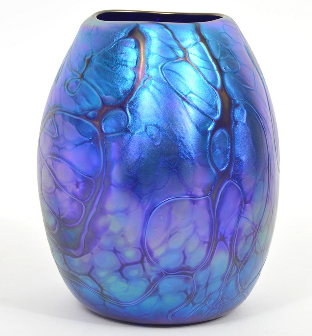 Arthur Allison Art Glass Vase: Arthur Allison blue iridescent art glass vase. Marked on the bottom. 6.75" H x 5" W. Condition report: good. Please examine all photos closely. Contact C. Biddle Auction Gallery for more detailed info
