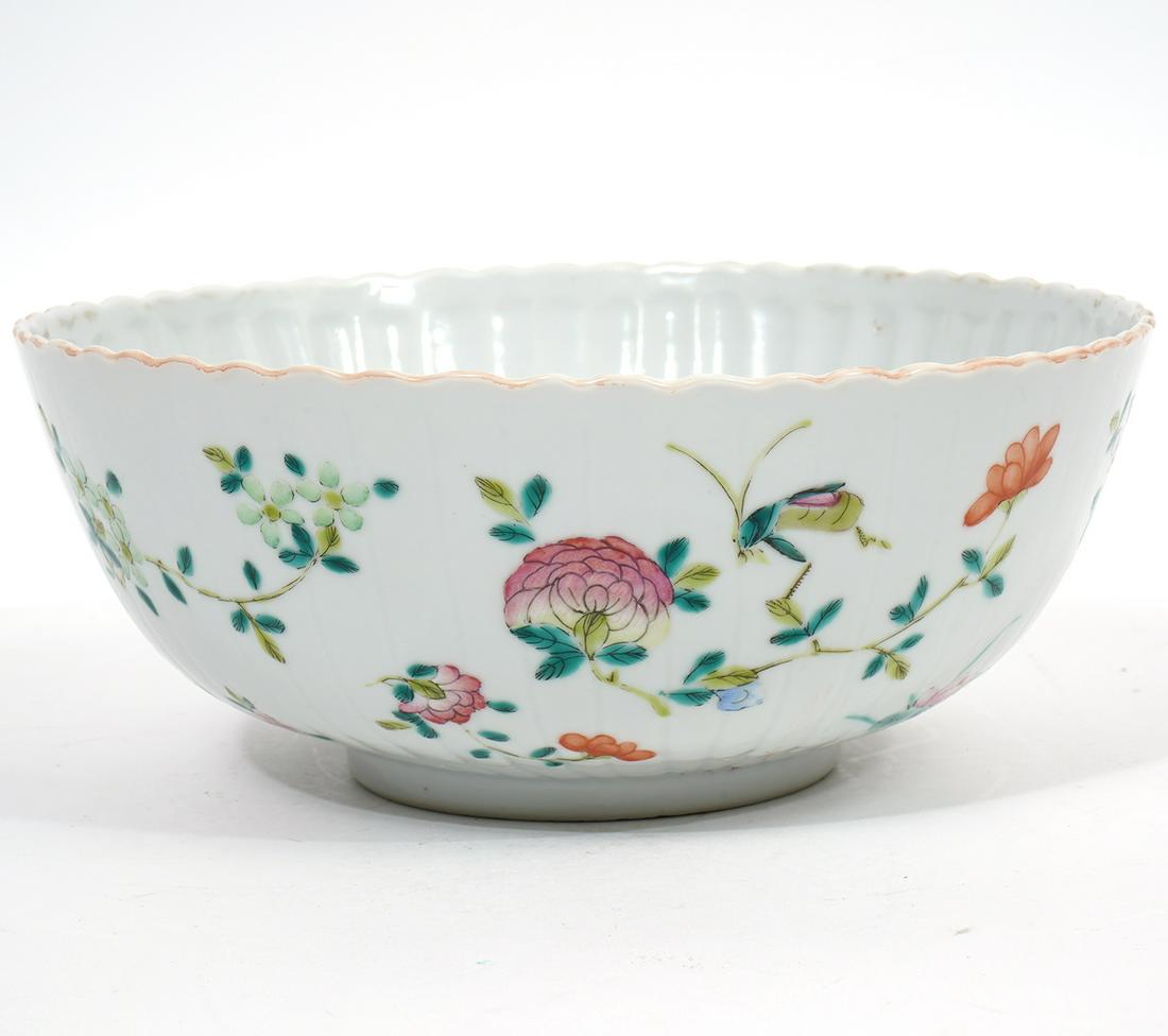 Chinese Famille Rose Porcelain Bowl: Chinese porcelain bowl in a Famille Rose and pomegranate pattern. Marked 'China' on the bottom. 8" W x 3.25" H. Condition report: good condition with minor wear. Please examine all photos closely. Con