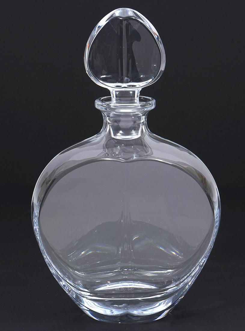 Baccarat French Crystal Decanter: Baccarat French crystal decanter, simple contemporary design, measures 6"L x 2.75"W x 10"H. Condition report: Very minor scratches underside from use, please examine all photos closely. Contact C. Bid
