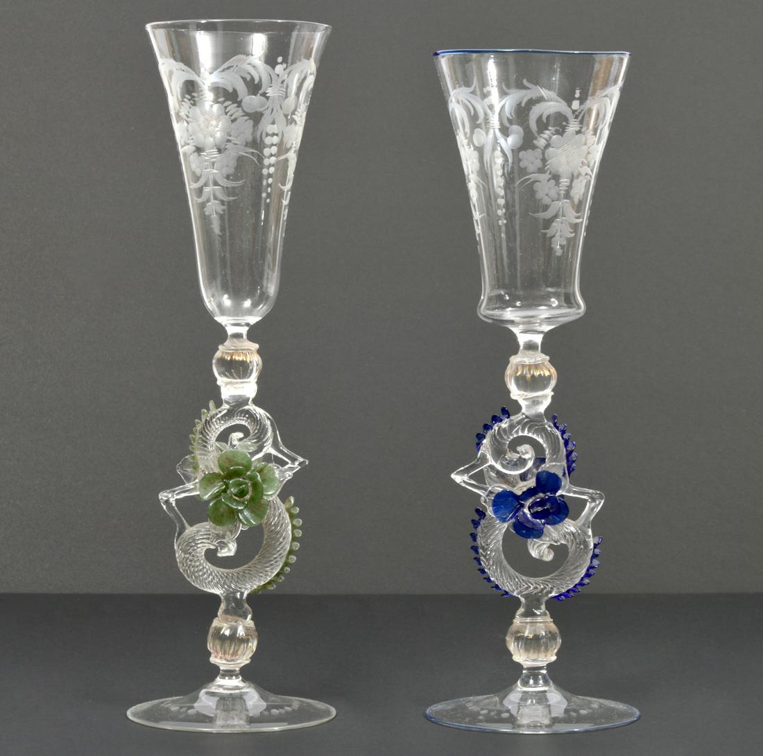 Pair of Venetian Hand Blown Art Glass Wine Goblets: Pair of Venetian hand-blown art glass wine goblets, features twisted stem and etched floral design. Measures 3.5"W at base, 11" and 11.75"H. Condition report: Good condition, no issues, please examine