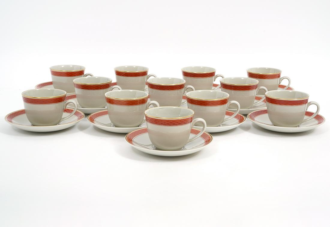 24Pc Royal Copenhagen Aluminia Tea Cups & Saucers: Royal Copenhagen Denmark Aluminia Oranje pattern, 12 tea cups (3.75"W x 2.5"H) & 12 matching saucers(5.5"). Condition report: Very minor surface cracks to glaze throughout, Please examine all photos c