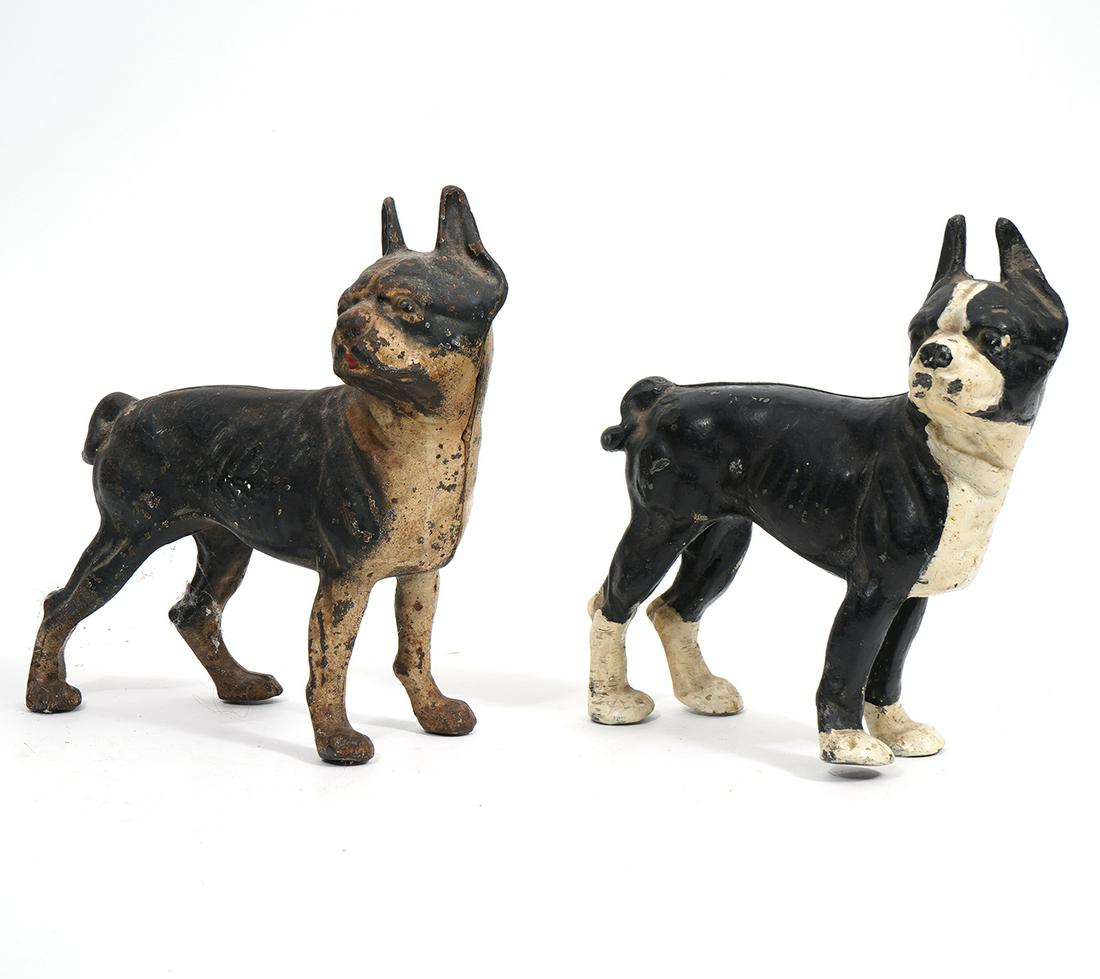 Pair of Cast Iron Boston Terrier Door Stoppers: Pair of painted cast iron Boston Terrier door stoppers, measures 8.5"L x 4"W x 9"H. Condition report: Paint loss throughout, please examine all photos closely. Contact C. Biddle Auction Gallery for mo