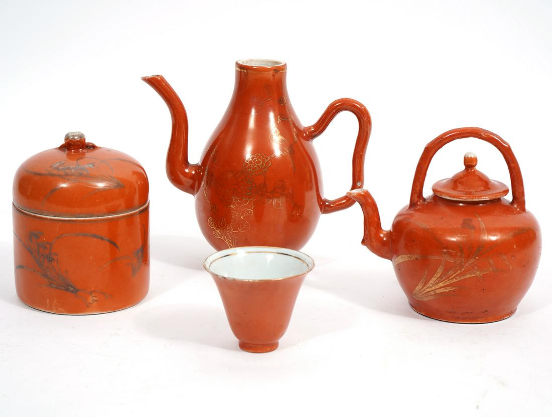 Chinese Orange Floral Porcelain Group: Chinese orange floral porcelain group includes: Teapot 4.5"L x 3.5"W x 4.5"H; Teapot without lid, 6"L x 3.25"W x 5.5"H; Lidded Jar with tea cup, underside had red character stamp, 4"H x 3"W; Condition