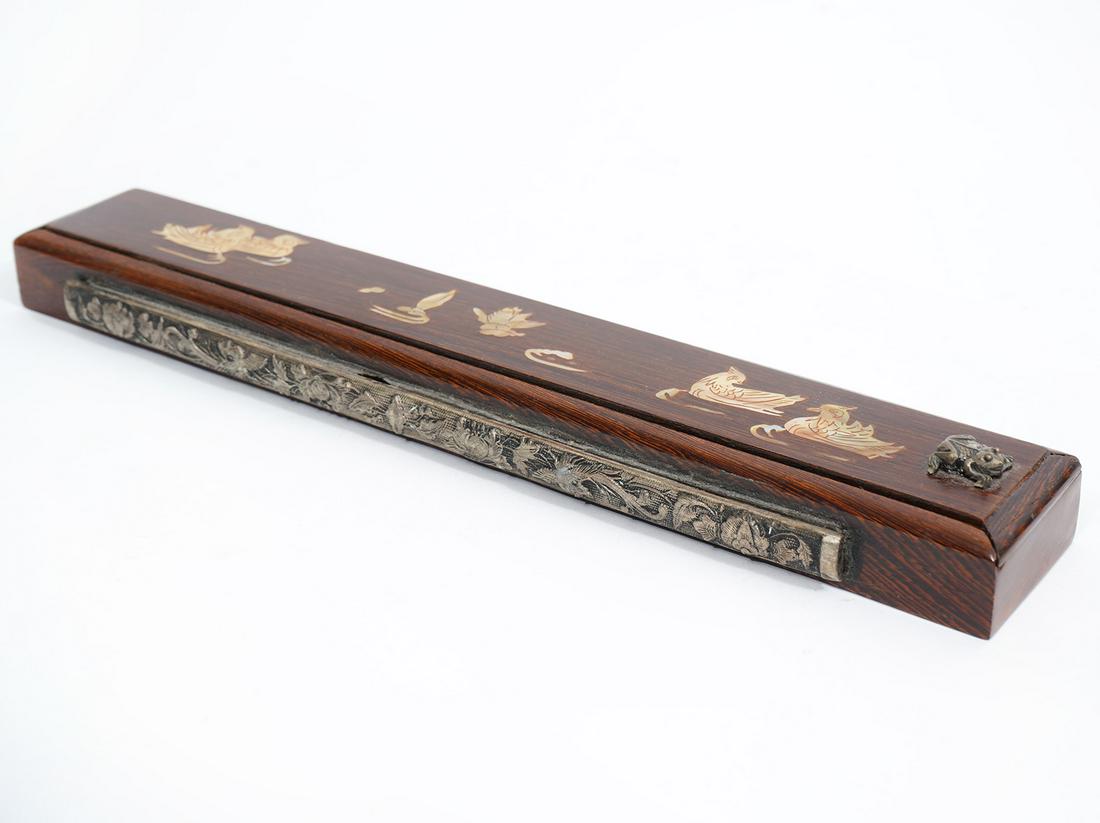 Chinese Inlaid MOP Wood Chopsticks Case: Chinese dark wood slide-top chopsticks case, featuring inlaid mother of pearl ducks. Accented by metal frog ornament on top and birds and flowers on side. Two pairs of chopsticks inside. Measures 11"L