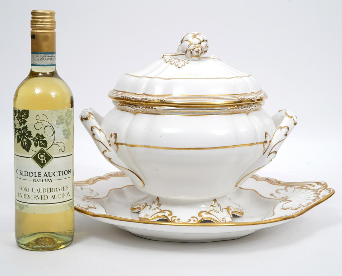 Spode English Tureen and Underplate: Spode bone china tureen and underplate, with accord finial, gilt accents. Measurements: Tureen 12"L x 8.5"W x 11"H; Underplate 15"L x 13"W; Condition report: Finial has been repaired, hairline cracks.