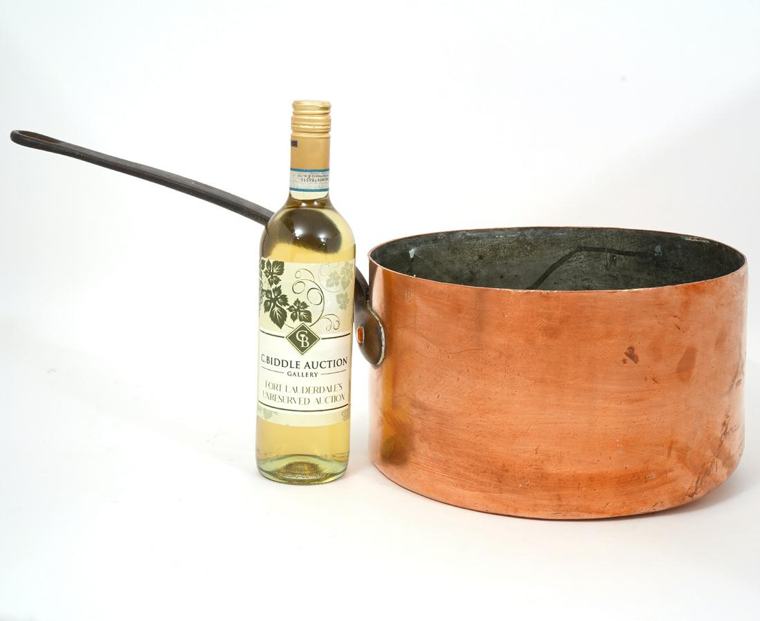 America Copper Pot with Iron handle: American copper pot with iron handle, measures 7.25"H x 12.5"W, 12" long handle. Condition report: Common wear and oxidation throughout. Please examine all photos closely. Contact C. Biddle Auction Ga