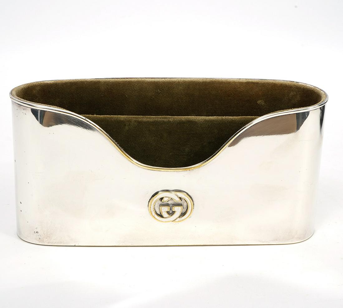 Gucci Silver & Gold Tone Desk Accessory: Gucci silver tone desk accessory for letters, envelopes, etc., trimmed in gold tone. Double G on front, Gucci Italy stamped on back. Interior is covered in velvet and is divided into 2 compartments. M