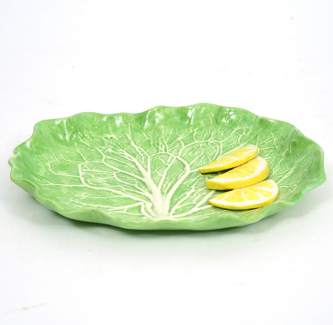 Dodie Thayer Lettuce and Lemon Dish: Dodie Thayer lettuce and lemon dish, measures 7.5"L x 5.5"W. signed underside.Condition report: Good condition, no issues , please examine all photos closely. Contact C. Biddle Auction Gallery for mor