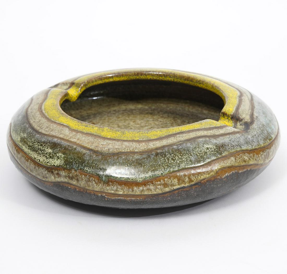 Italian Hand-Made Pottery Ashtray by Raymor: Italian hand-made glazed pottery two-finger ashtray, signed "Raymor". Measures 8.5"W x 2.25"H. Signature underside. Condition report: Good condition, no issues , please examine all photos closely. Con