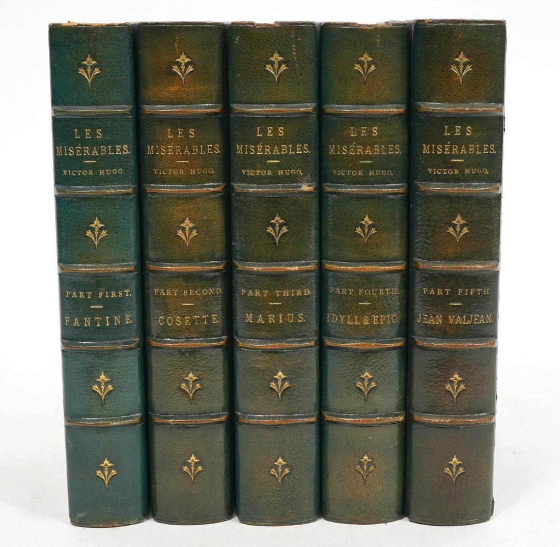 5 Vol. 'Les Miserables' by Victor Hugo: 5 Volumes 'Les Miserables' by Victor Hugo, navy leatherbound with gilt writing on spines. Publisher Little, Brown and Co., Boston, 1887. Measures 7.5"H x 5"W. Condition report: light wear to covers, p