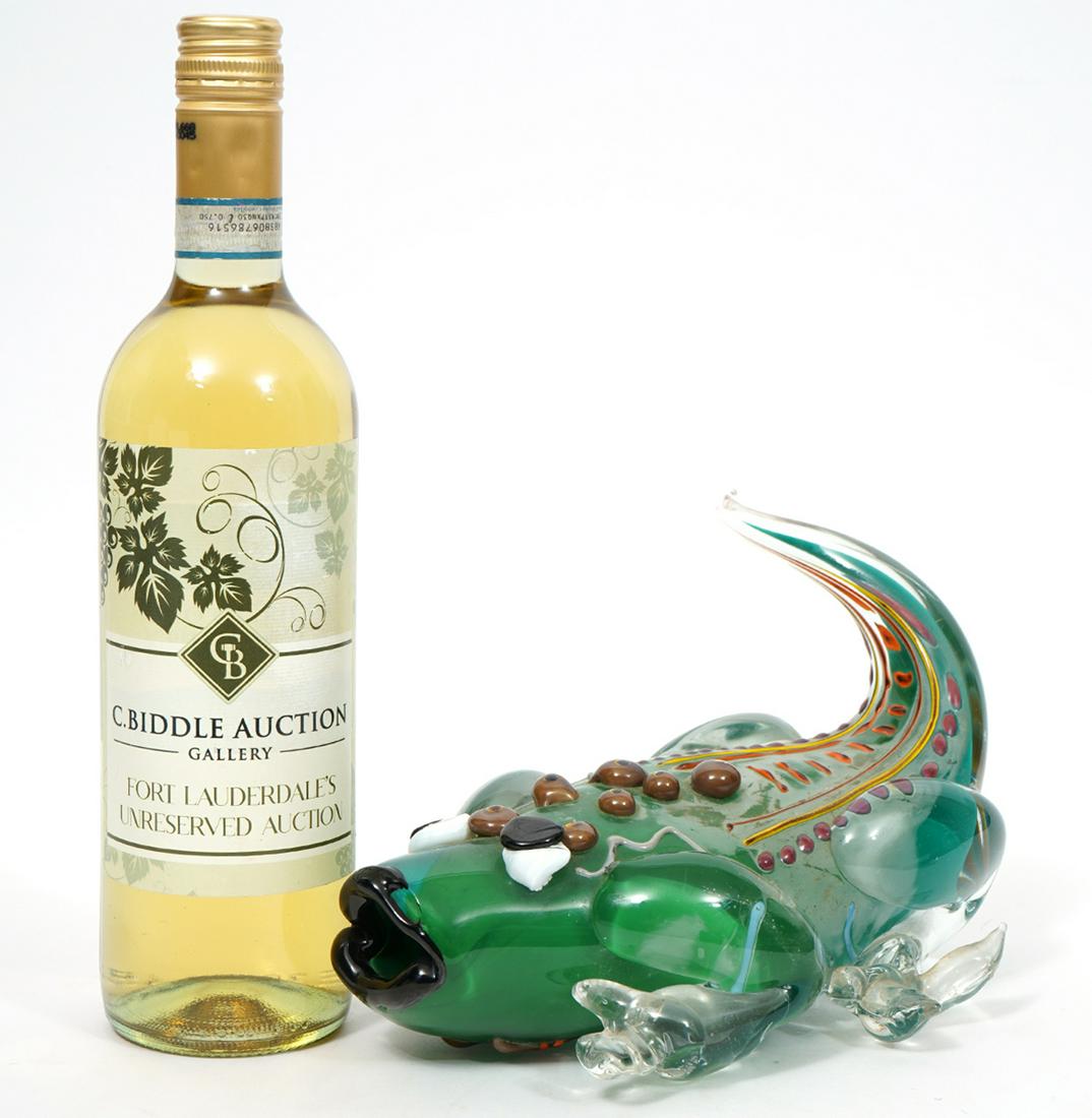 Janet Kelman Signed Art Glass Lizard Sculpture: Art glass lizard sculpture signed by artist Janet Kelman, dated 1986. Measures 9.5"L x 6.5"W x 5.5"H. Condition report: Various chips to feet, please examine all photos closely. Contact C. Biddle Auct