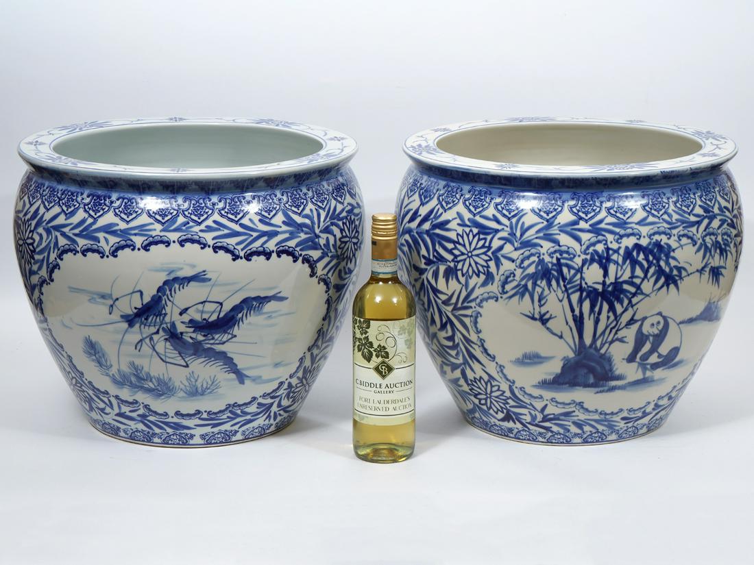 Pair of Chinese Blue and White Jardinieres: Pair of Chinese blue and white porcelain jardinieres, one had been restored. Decorated with vignettes of fish, shrimp and panda with traditional floral patterns. Measures 14"H x 16.5"W. Condition repo