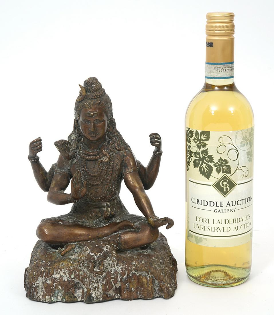 Bronze Four Armed Seated Buddha With Tiger: Bronze four armed seated buddha with tiger head, measures 6.5"l x 4.75"W x 9"H. Condition report: Common wear and oxidation for age, please examine all photos closely. Contact C. Biddle Auction Galler