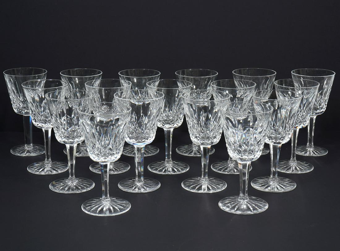 Set of 17 Waterford 'Lismore' White Wine Glasses: Set of 17 Waterford 'Lismore' white wine glasses, each measures 5.75"H. Hallmarked underside. Condition report: Good condition, no issues, please examine all photos closely. Contact C. Biddle Auction 
