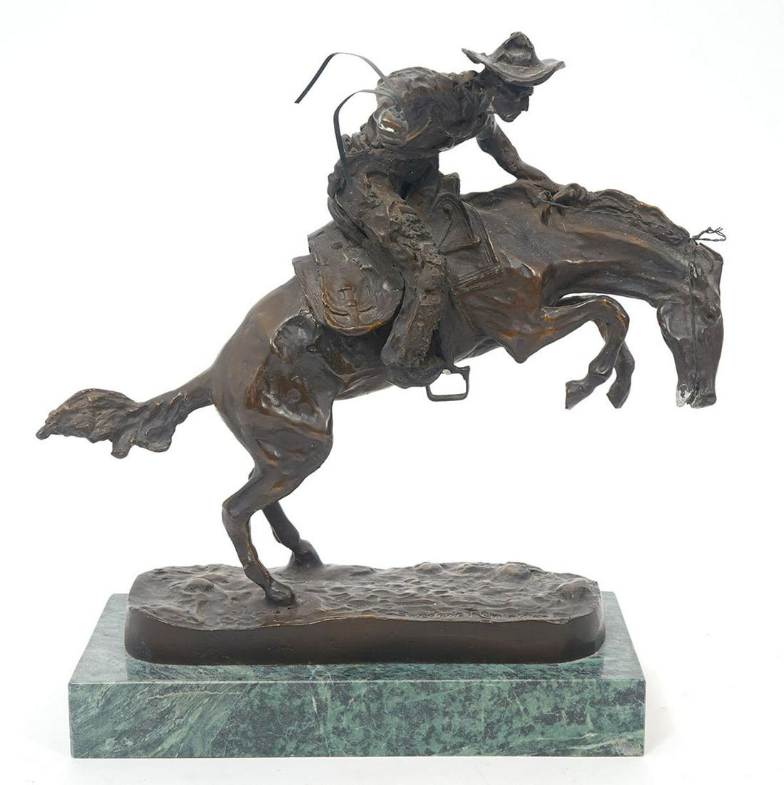 After Remington "Bronco Buster" Bronze on Marble: After Frederic Remington "Bronco Buster" patinated cast bronze mounted on green marble base. Measures 10.5"L x 7"W x 11"H. Condition report: Good condition, no issues, please examine all photos closel