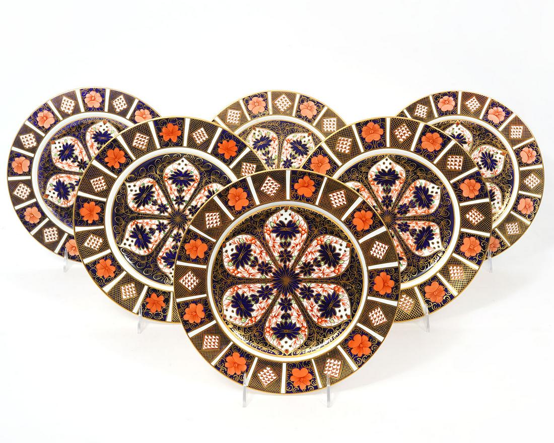 6 Royal Crown Derby Old Imari Dinner Plates: 6 Royal Crown Derby Old Imari English bone china dinner plates trimmed in 22K yellow gold. Measures 10.25"W. Condition report: good condition, please see all photos. Contact C. Biddle Auction Gallery