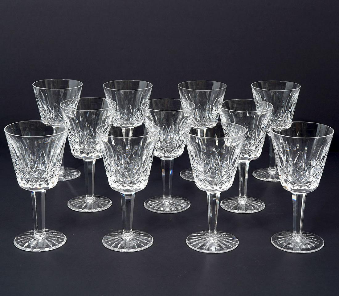11 Waterford Lismore Crystal Claret Glasses: 11 Waterford Lismore Crystal Claret wine glasses, etched Waterford on underside. Classic diamond and wedge cut design with faceted stems. Measures 5.75"H. Condition report: good condition, no issues, 