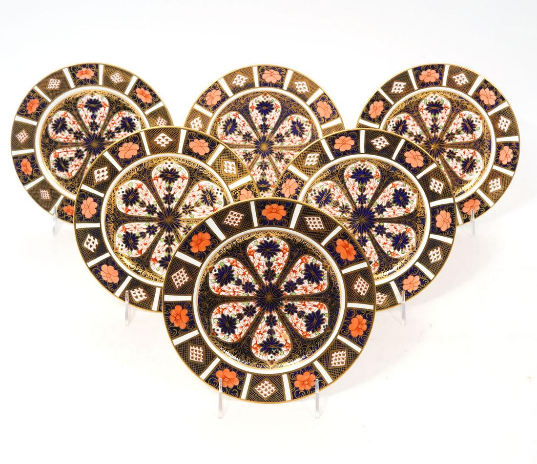 6 Royal Crown Derby Imari Salad Plates: 6 Royal Crown Derby Imari 22K gold rimmed bone china salad plates, marked underside. Measures 8"W. Condition report: good condition, please see all photos.Contact C. Biddle Auction Gallery for more de