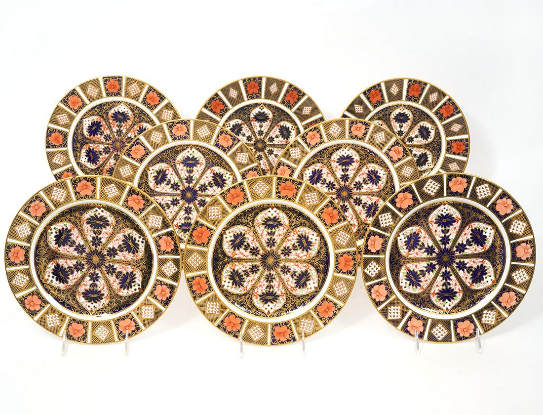 8 Royal Crown Derby Old Imari Dinner Plates: 8 Royal Crown Derby Old Imari English bone china dinner plates. Trimmed in 22K yellow gold. Measures 10.25"W. Condition report: good condition, please see all photos. Contact C. Biddle Auction Gallery