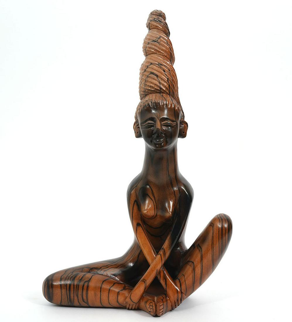 Southeast Asian Carved Nude Female Figure: Southeast Asian, possibly Indonesia or The Philippines, carved wood figure of nude female in seated position. Missing one earring. Measures 10"L x 4.5"W x 16.5"H. Condition report: Good condition, no 