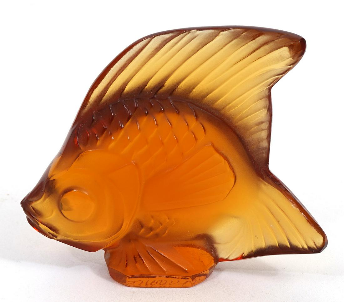Lalique Crystal Amber Fish: Lalique France crystal amber fish signed on side. Measures about 2" H. Condition report: great, no issues. Please examine all photos closely. Contact C. Biddle Auction Gallery for more detailed inform