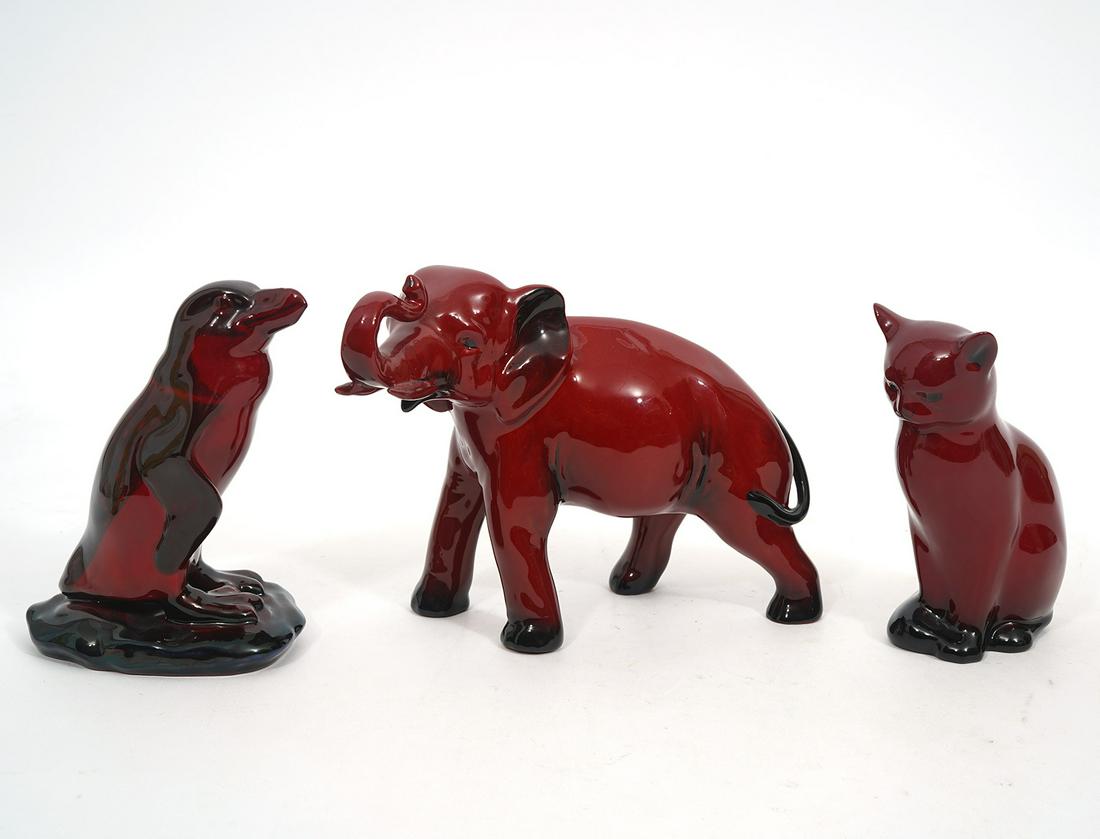 Three Royal Doulton Flambe Animals: Royal Doulton flambe porcelain group includes: Elephant (7"L x 3.5"W x 5.5"H); Cat (2.5"L x 2"W x 5"H); Penguin ( 4"L x 3"W x 5"H); All hallmarked underside. Condition report: Good condition, no issue