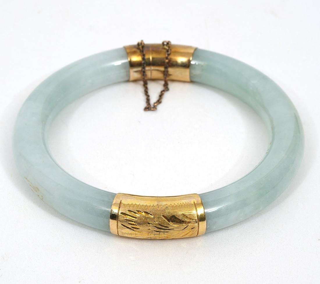 Jade Bangle with Engraved Gold Accents: Jade with engraved gold mounted accents and safety chain. Approximately 7" inner circumference. Width 10cm. Condition report: Good condition, no issues, please examine all photos closely. Contact C. B